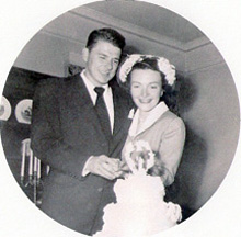 Nancy and Ronald Reagan cut their wedding cake