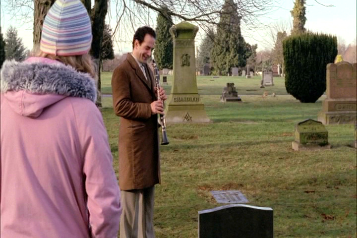 Adrian Monk laughing at Trudy's graveside