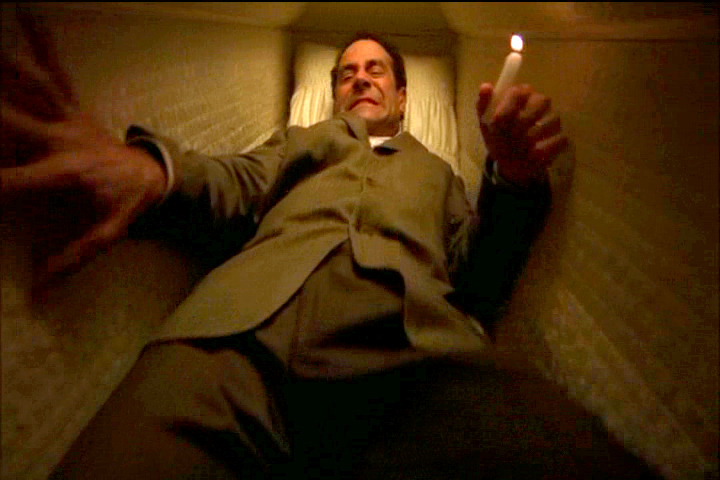 Adrian Monk buried alive in a coffin
