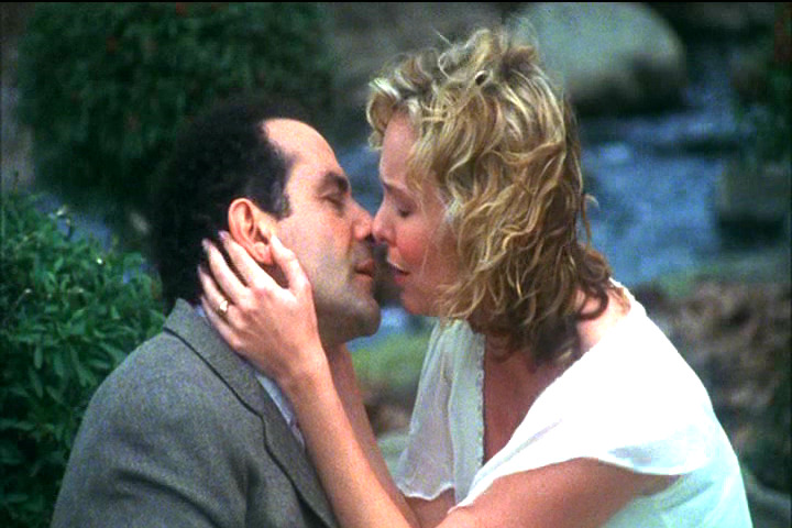 Melora Hardin kissing Tony Shaloub