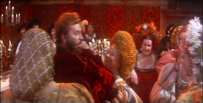notice the Widow's smug look as Petruchio pushes past her