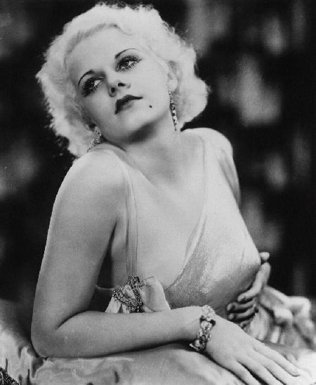 Jean Harlow gently cups her breast