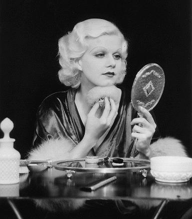 Jean Harlow holding a mirror
