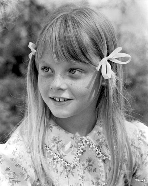 childhood image of young Jodie Foster wearing pigtails