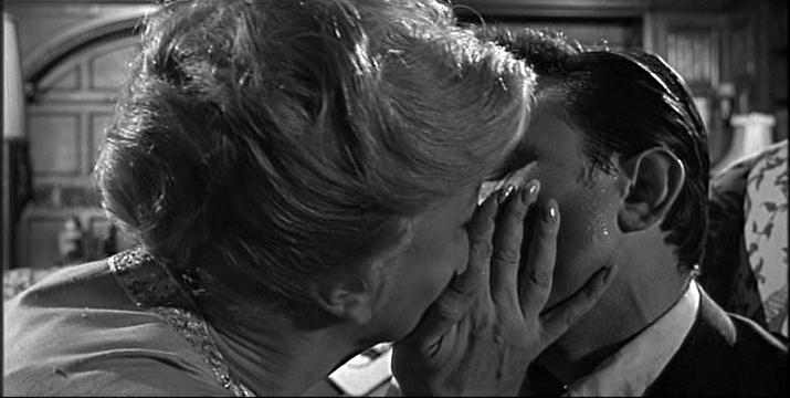 Angela Lansbury kisses Laurence Harvey in The Manchurian Candidate
