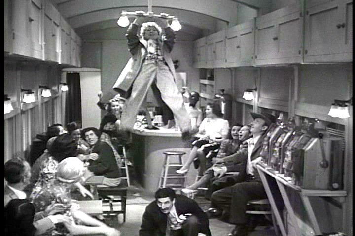 Harpo Marx swinging from the light fixture