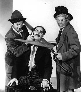 Harpo's about to cut off Groucho Marx' head