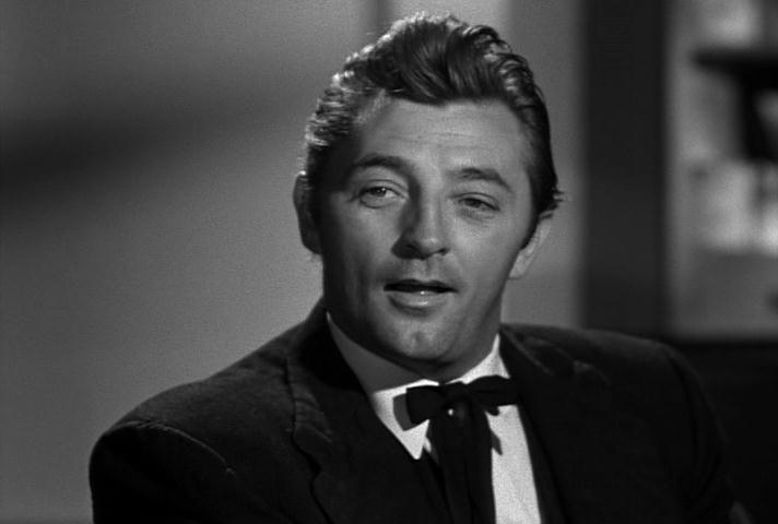Robert Mitchum as Harry Powell in Night of the Hunter