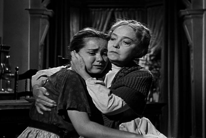 Gloria Castilo cries on Lillian Gish's shoulder