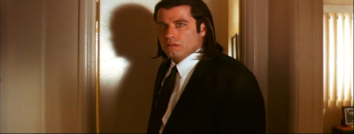 John Travolta as the thoroughly screwed Vincent Vega in Pulp Fiction