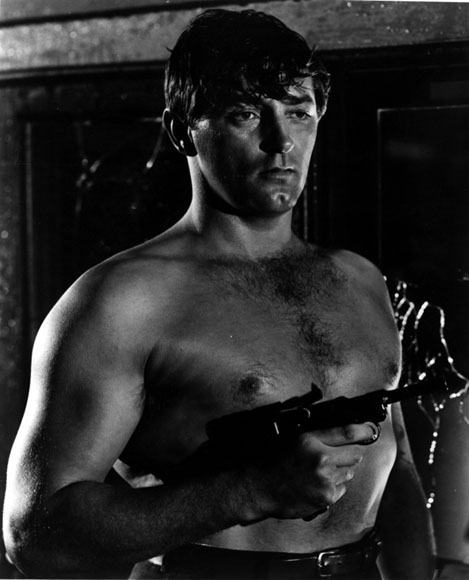 shirtless Robert Mitchum with a sexy gun