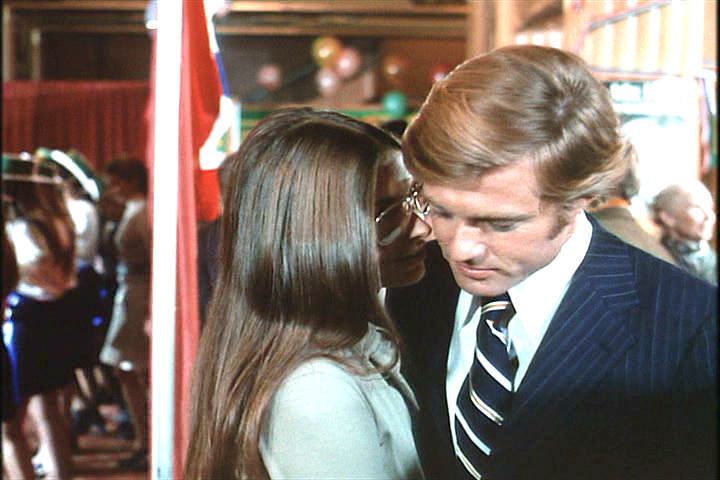 groupie whore Susan Demott whispering in Robert Redford's ear