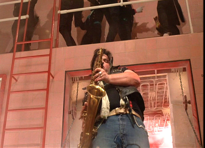 Meatloaf playing saxophone