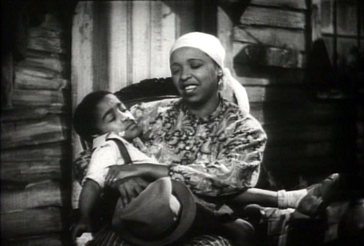 mother Ethel Waters rocks her son to sleep