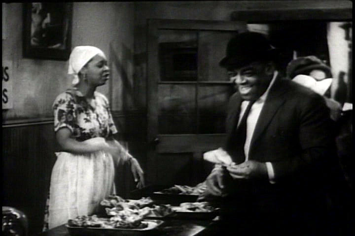 Ethel Waters serves up the chicken and pork chops to her son's constituents