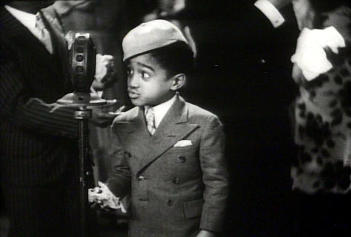 young Sammy Davis gives a cute kid look