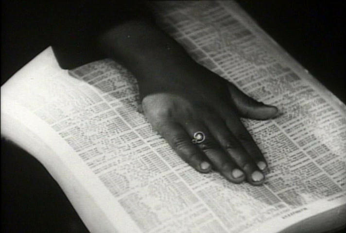 Sammy Davis Jr's hand on, apparently, a telephone book