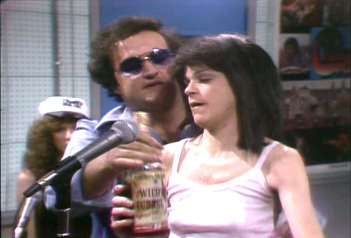 John Belushi takes Gilda Radner's whiskey away