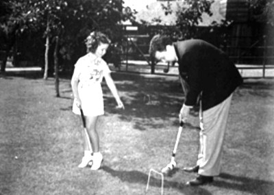 Shirley Temple playing croquet with Orson Welles