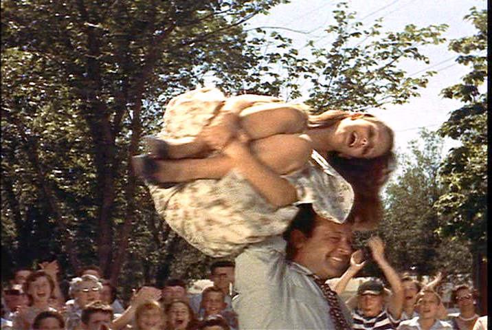 William Holden and Susan Strasberg in a girl carrying contest