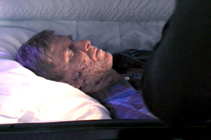 Curtis Lemansky's corpse resting in his coffin