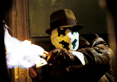 Rorschach aka Walter Kovacs dispenses flaming justice in The Watchmen