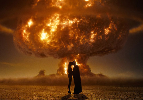 kissing in front of a mushroom cloud