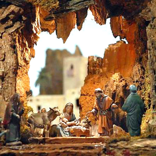 small nativity scene set up inside a tree