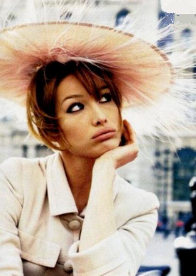 Carla Bruni with a feathery hat