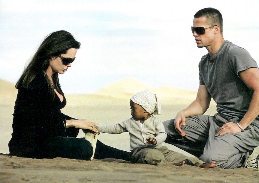 Brad Pitt, Angelina Jolie, and one of their 1000 beautiful children