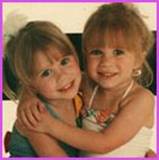 childhood photo of young Ashley and Mary-Kate Olsen