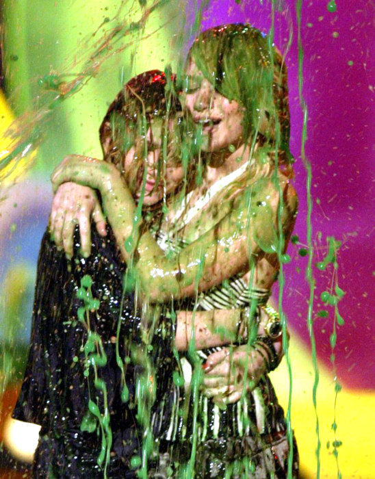 the Olsen twins are drenched in green slime