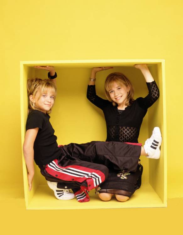 the pre-pubescent Olsen twins are boxed in