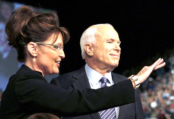 John McCain does look something like a proud father here