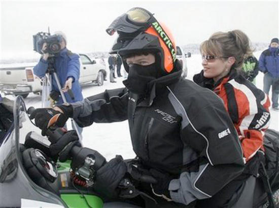 Todd and Sarah Palin on a snowmobile