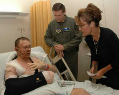Governor Sarah Palin visiting a wounded soldier