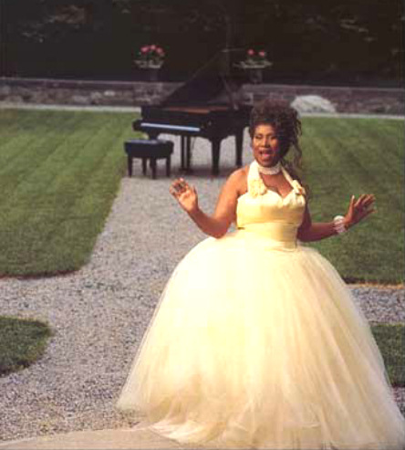 elegant garden scene with Aretha Franklin in big ol' frilly dress