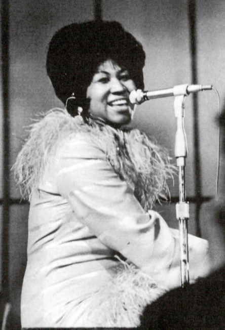 Aretha Franklin playing piano