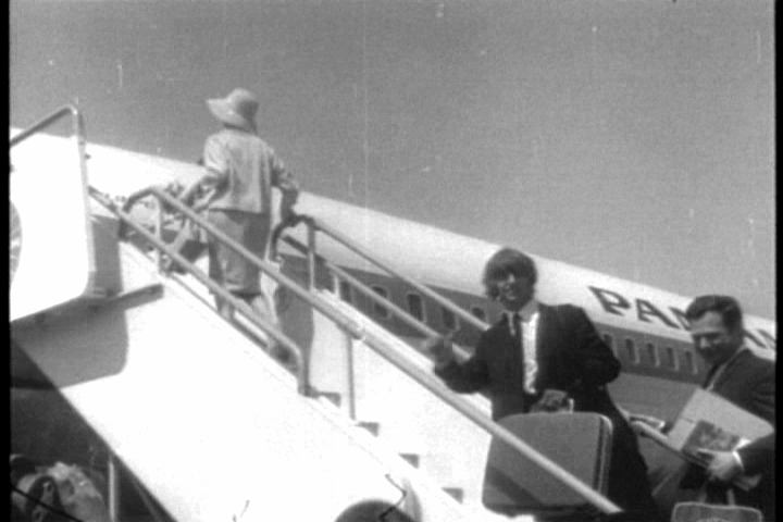 Brian Epstein and Ringo Starr getting on a plane