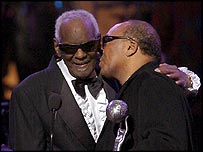 Quincy Jones kissing Ray Charles