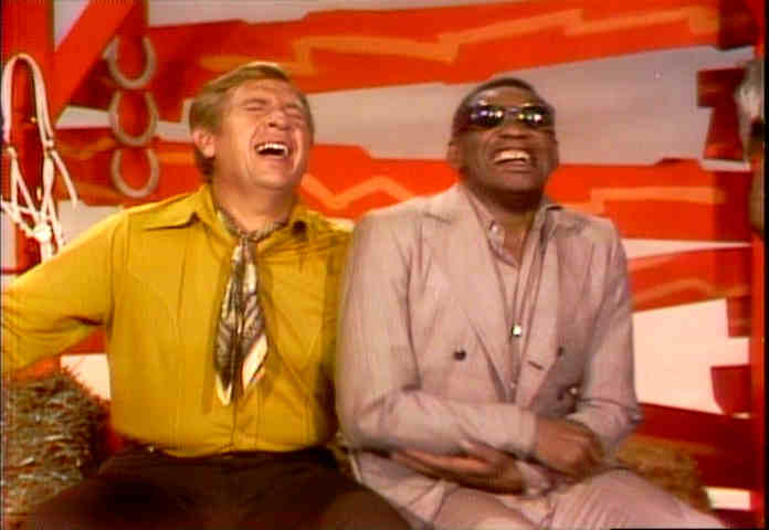 Buck Owens and Ray Charles laughing like hyenas