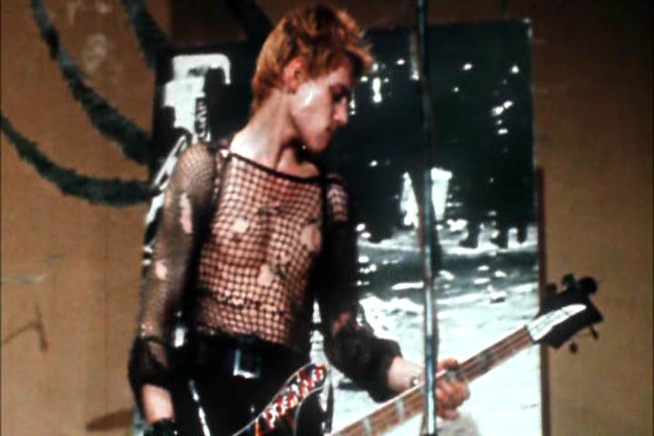 highly homoerotic looking Paul Simonon playing bass with The Clash in 1977