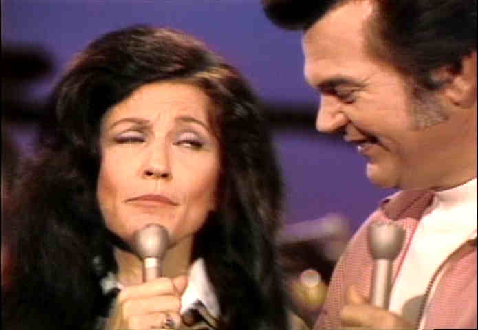 Loretta Lynn gives Conway Twitty the evil eye