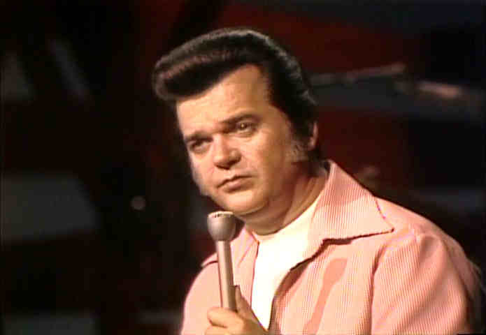 Conway Twitty with a far away look in his eyes