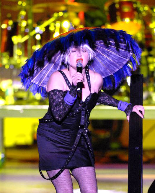 Cyndi Lauper singing on stage