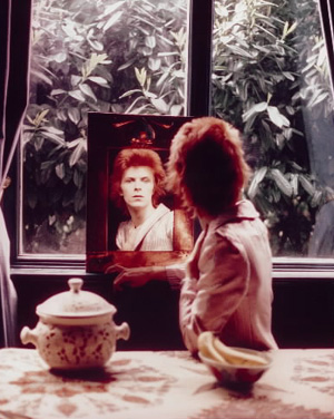 David Bowie looks in the mirror