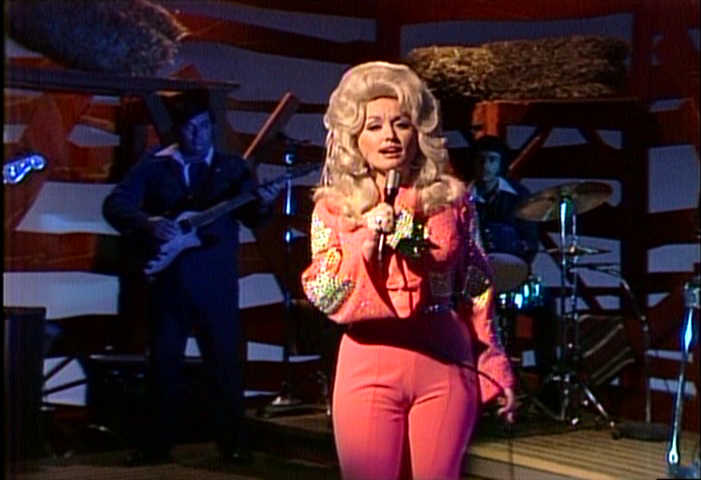 Dolly Parton singing with her band, 1975 image
