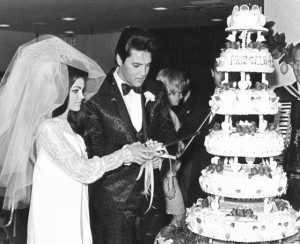 Elvis and Priscilla Presley - newlyweds cutting the cake
