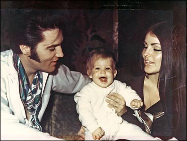 casual picture of mom and dad with baby Lisa Marie Presley