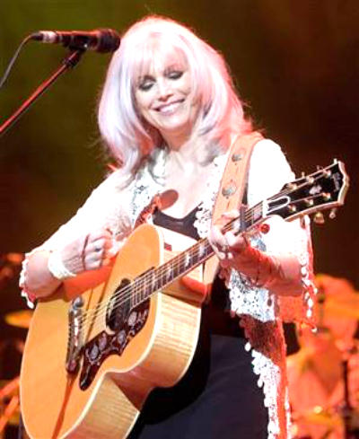 Emmylou Harris playing guitar